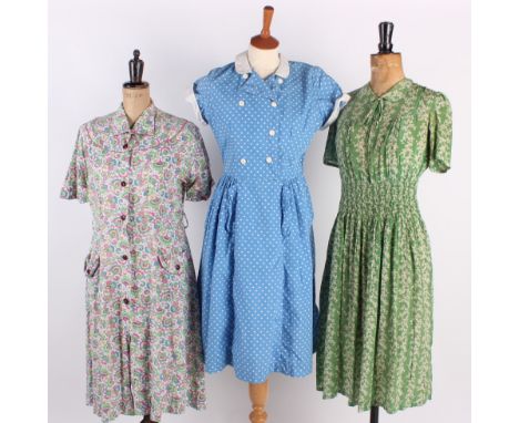 A green and white floral crepe tea dress with smocked waistline; together with a brown and white short-sleeved striped blouse