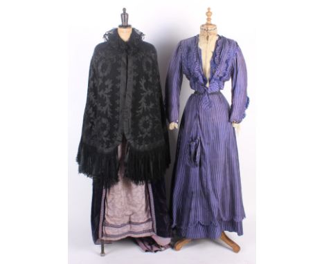 Five items of 19th and early 20th century ladies costume; comprising: a lilac and cream striped two-piece silk costume circa 