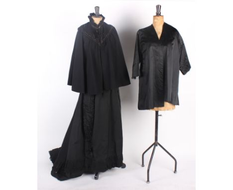 A 19th century black woollen cape embellished with beadwork detail; with a 19th century black two-piece costume, a  black sat