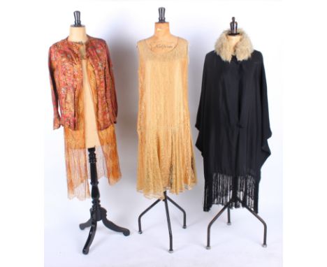 A 1920s brown and gold lace dress; with a 1920s black velvet cape with gold lining, 1920s blonde lace dress, 1930s pale pink 