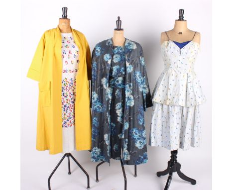 A late 1950s blue floral patterned dress with matching duster coat; a Horrockses blue and white spotted sun-dress, a cream si