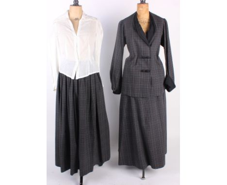 A 19th century white lawn blouse; an early 20th century checked grey wool skirt and jacket, black silk full-length skirt, a s