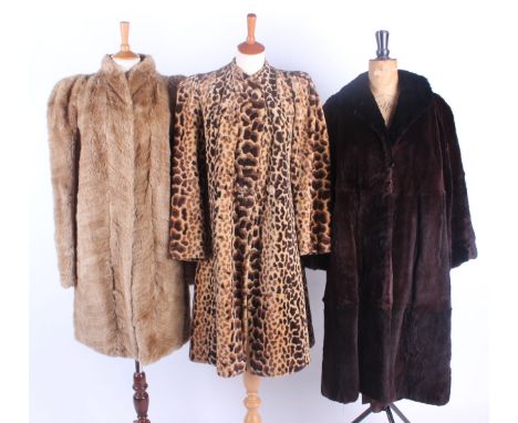 A striking late 1930s faux fur animal print coat; together with a pale fur coat of the same era with an unusual Art Deco insp