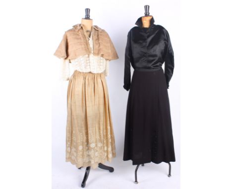 A pale fawn Edwardian dress with lace and embroidered detail to the bodice; with a 19th century brown tweed shoulder cape, a 