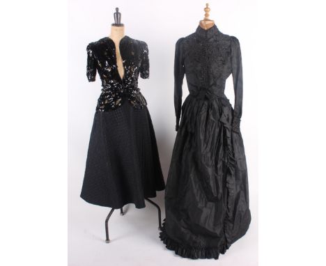 A late 19th century plum coloured jacket, a 19th century black mourning blouse embellished with bead and jet decoration, two 