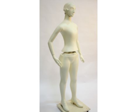 A composition white spray painted female shop display mannequin, circa 1980s, with adjustable height/waist, arms and hands an