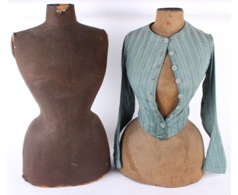A pair of late 19th century display mannequins, the first is covered with brown linen, the second of a paler linen, and weari