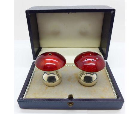 A Danish silver and cherry coloured guilloche enamel novelty toadstool shaped salt and pepper set, boxed 