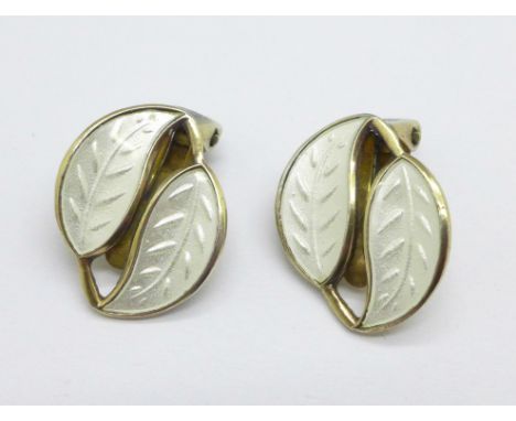 A pair of Norwegian silver gilt and white enamel clip-on earrings by David Andersen 