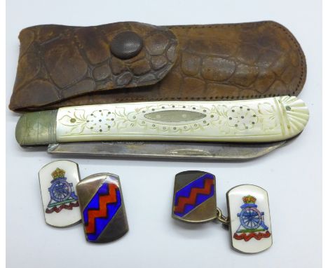 A pair of silver and enamel Royal Artillery cufflinks and a silver and mother of pearl fruit knife, (tip of blade a/f) 