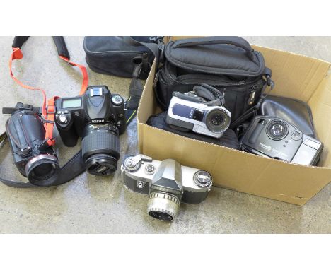 A Praktica Nova camera, a Nikon D50 camera and other cameras 