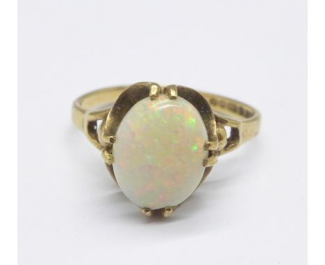 A 9ct gold and opal ring, 2.1g, K, (chip to the edge of the stone behind the claws) 