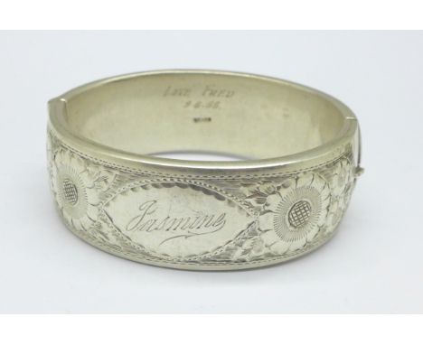 A silver bangle, with inscription dated 1955, 61g 