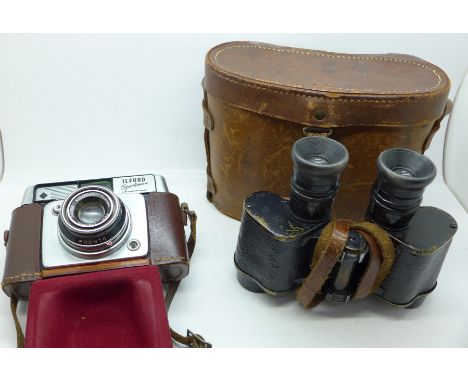 A pair of military issue binoculars, Hunsicker &amp; Alexis, Paris, and an Ilford Sportsman camera 