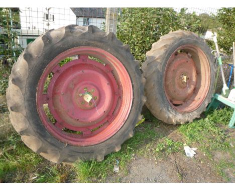 A pair of 6 - stud fitting Nuffield tractor rear wheel centres, wheel rims, tyres (Dunlop &amp; Good-Year) and inner tubes, 1