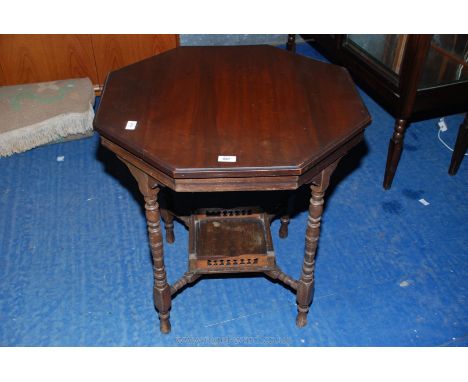An octagonal occasional table on turned legs with square shelf under 27" x 27" x 27".