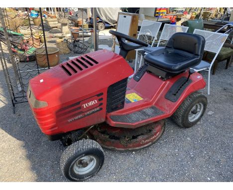 Toro Wheel Horse 12-32 XL Ride-on Lawn Mower having a 12 HP Briggs &amp; Stratton engine, running order, cutting deck has rus
