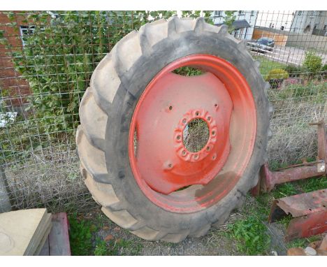 An 8 stud fitting Nuffield tractor rear wheel, tyre and inner tube, believed 12.4 / 11 x 36".
