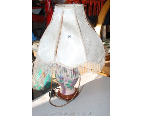 Pottery table lamp with damaged shade.