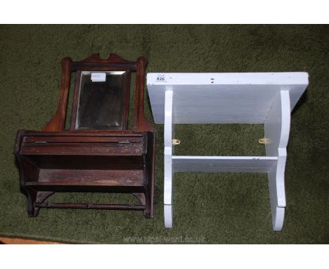 A small wooden mirrored back wall shelf and a painted wall shelf.
