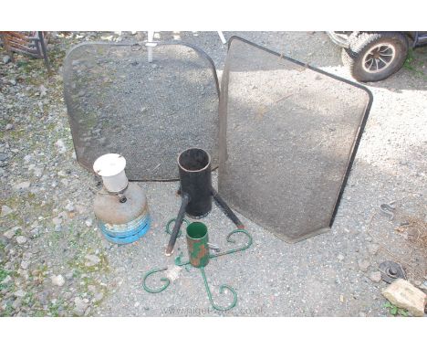 Two metal spark guards, Christmas tree stands and gas lamp