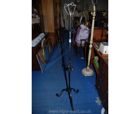 A wrought iron standard lamp.