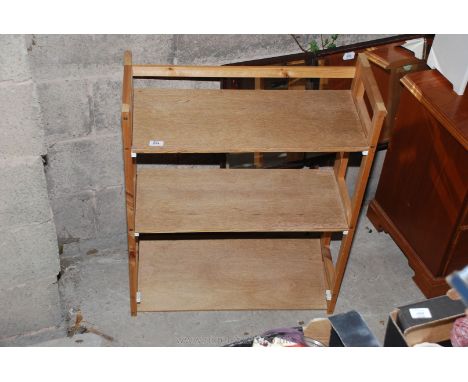 A folding three shelf display sand