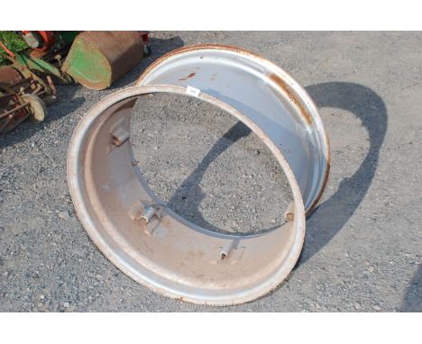 A silver paint finished 30" diameter 15" wide rear wheel rim apparently suitable for a Zetor Proxima series 75 / 80 tractor. 