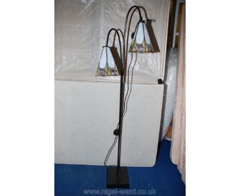 A Twin Tiffany style metal floor lamp.