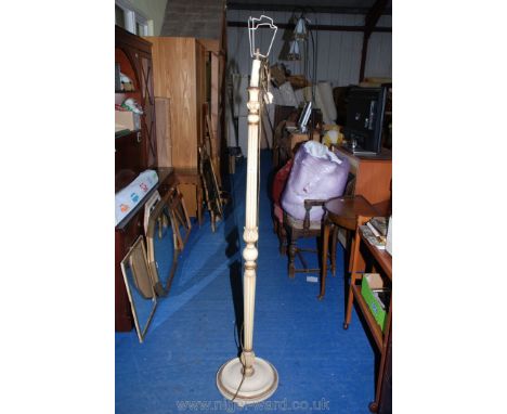 A reeded wooden standard lamp.