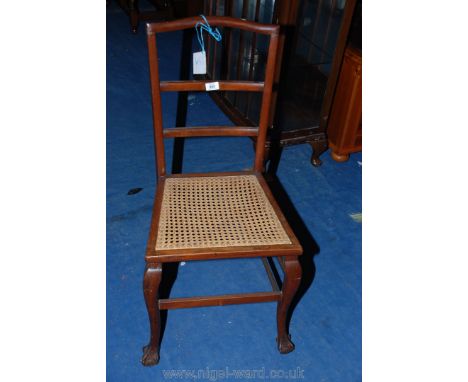 A cane seated ladder back hall chair.