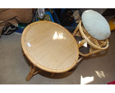 Bamboo coffee table with under shelf and cane topped foot stool and cushion 21" high x 23" diameter.