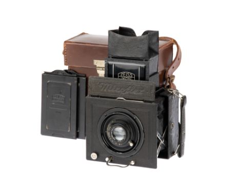 A Zeiss Ikon Miroflex A 859/3 Medium Format SLR Camera, 1929-36, black, serial no. Q 62392, 6.5cm x 9cm, with a Carl Zeiss Je