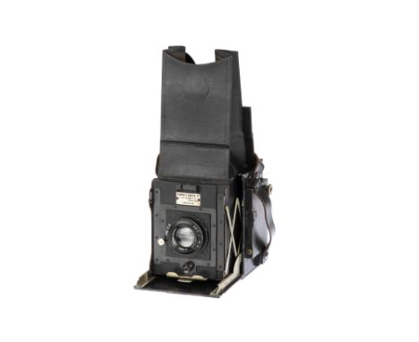 A Newman &amp; Guardia 3¼ x 3¼ Folding Reflex SLR Camera, 1921-30, black, serial no. appears not to be present, with Ross Pat