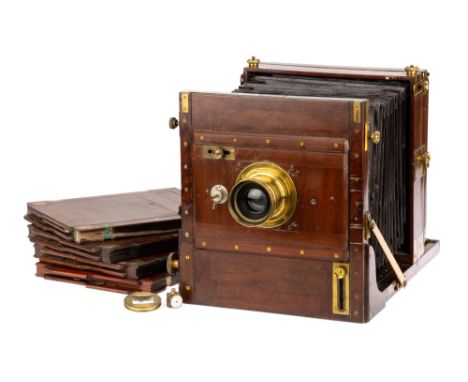 An Adams &amp; Co. Mahogany &amp; Brass Whole Plate Tailboard Camera, 1900-, with integrated shutter behind lens board, with 