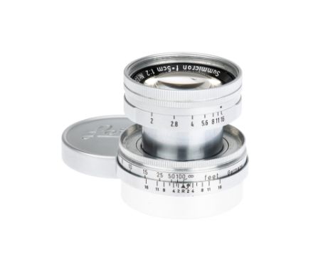 A Leitz Summicron f/2 50mm Lens, 1956, chrome, serial no. 1395948, body, VG-E, elements, VG, complete with maker's lens cap a