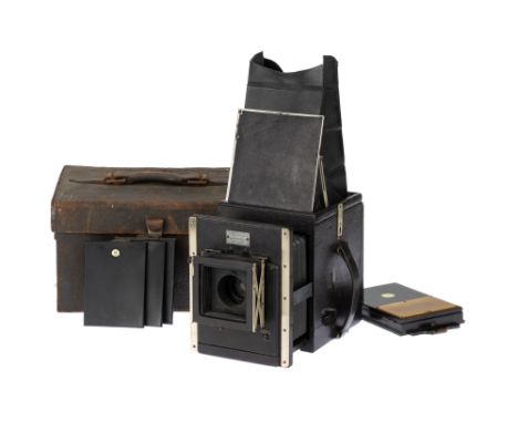 A Newman &amp; Sinclair Reflex Box Type SLR Camera, 1911, black, serial no. 157, with part-complete taking lens, missing rear