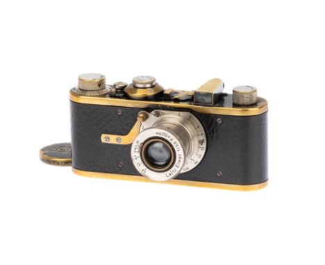 A Leica Ia '4-digit' Camera, 1927, black, serial no. 3516, with Leitz Elmar f/3.5 50mm lens, body, F-G, shutter working, lens