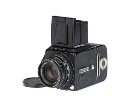 A Hasselblad 500C/M Medium Format Camera, 1981, black, serial no. 1258059, with a Carl Zeiss Planar f/2.8 80mm lens, camera b