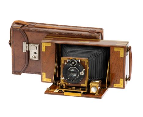 A London Stereoscopic Co. King's Own Deluxe Model B Tropical Folding Camera, 1911, teak, roll-film camera, with Goerz Doppel 