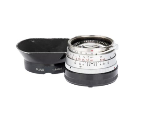 A Leitz Summilux f/1.4 35mm 'Steel Rim' Lens, 1964, chrome, serial no. 2061236, body, F, elements, F-G, some cleaning/coating