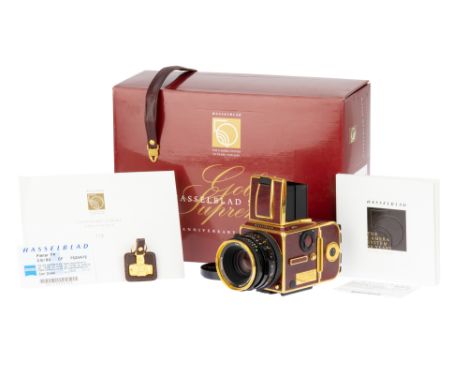 A Hasselblad 503CW Gold Supreme 50th Anniversary Camera, 1988, gold / red, serial no. 19EU14351, camera edition no.119, with 