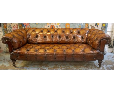 CHESTERFIELD SOFA, Victorian mahogany, circa 1870, in brown leather on ceramic castors, 69cm H x 210cm W x 91cm D. 