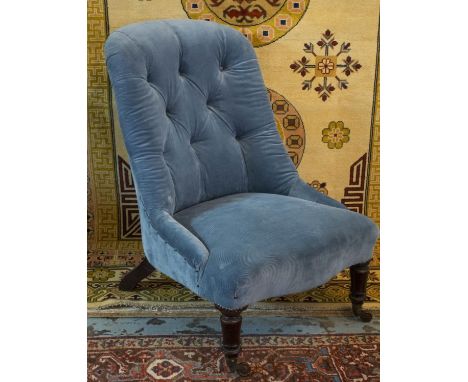 SLIPPER CHAIR, Victorian mahogany in blue corduroy on ceramic front castors, 83cm H x 60cm. 