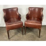 A Pair of Brown Leather Chairs
