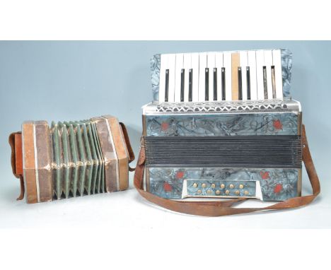 A Francesco Modello piano accordion with blue marbled effect veneer and red flower inlay, marked Made in Saxony. Together wit