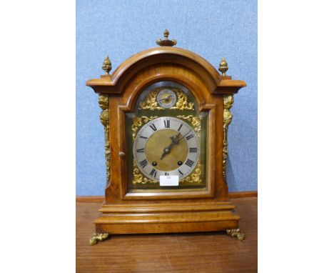 A George III style burr walnut and gilt metal bracket clock, 44cms h 