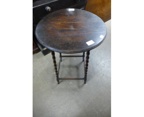 An oak bobbin turned circular occasional table 