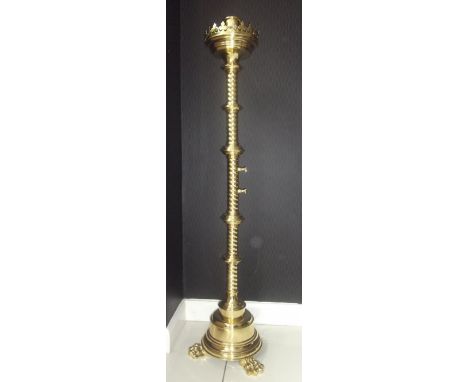 AFTER PUGIN, A FINE QUALITY BRASS LATE VICTORIAN NEO-GOTHIC,  'PASCHAL' CANDLE HOLDER OF LARGE SIZE, WITH A ROPE TWIST STEM, 