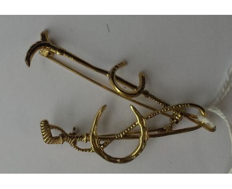 TWO SILVER GILT HUNTING BROOCHES